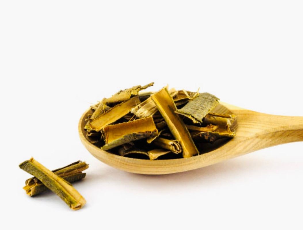 willow bark extract on wooden spoon